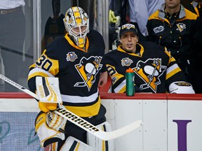 Pittsburgh Penguins goalie Matt Murray takes a breather with goalie Marc-Andre Fleury on the bench during a game against the New Jersey Devils on March 17, 2017. (AP Photo/Gene J. Puskar)