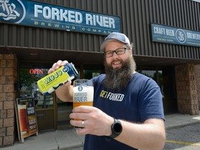 Dave Reed, founder of Forked River Brewing Co., pours their new summer brew called Mojo. Reed, like several other craft brewers in the cities east end, want to open patios. (MORRIS LAMONT, The London Free Press)