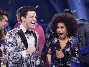 Kevin Martin, left, takes the Big Brother Canada Season 5 crown as host Arisa Cox looks on in this undated handout photo. Kevin Martin of Calgary won the fifth season of "Big Brother Canada" in Thursday night's finale on Global. The professional poker player took the $100,000 grand prize along with a $30,000 gift card from The Brick and a new 2017 Toyota '86. (THE CANADIAN PRESS/HO - Global TV)