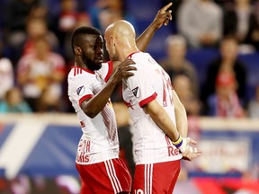 New York’s Kemar Lawrence (left) and Aurelien Collin have a chat earlier this season. (GETTY IMAGES)