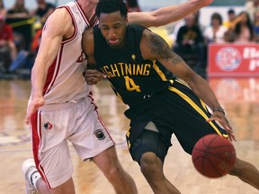 Logan Stutz, left, of the Windsor Express pressures Marcus Capers of the London Lightning during their game Thursday, May 18, 2017, at the Atlas Tube Centre Arena in Lakeshore, ON. (DAN JANISSE/The Windsor Star)