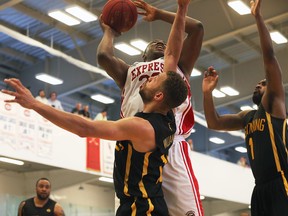 Shaquille Keith, left, of the Windsor Express works around Royce White of the London Lightning during their game Thursday at the Atlas Tube Centre Arena in Lakeshore, ON. (DAN JANISSE/The Windsor Star)