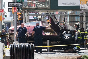 A wrecked car sits in the intersection of 45th and Broadway in Times Square, May 18, 2017 in New York City. According to reports there were multiple injuries and one fatality after the car plowed into a crowd of people. (Photo by Drew Angerer/Getty Images)