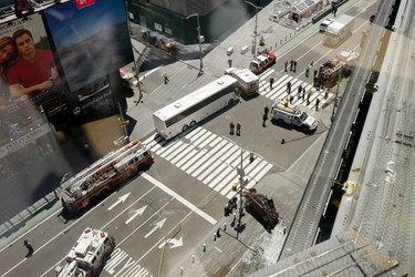 New York's Times Square is closed off by police vehicles following a car crash, lower right, Thursday, May 18, 2017.  A man who appeared intoxicated drove his car the wrong way up the Times Square street and plowed into pedestrians on the sidewalk injuring dozens authorities and witnesses said.  (AP Photo/Mark Lennihan)