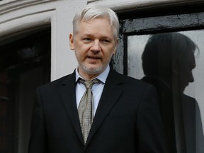 In this Feb. 5, 2016 file photo, WikiLeaks founder Julian Assange speaks from the balcony of the Ecuadorean Embassy in London. Sweden's top prosecutor said Friday May 19, 2017, she is dropping an investigation into a rape claim against WikiLeaks founder Julian Assange after almost seven years. (AP Photo/Kirsty Wigglesworth, File)