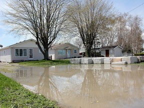 About 20 properties on Erie Shore Drive in Chatham-Kent were flooded May 2 when strong winds forced water from Lake Erie up onto the land and across the road. (Postmedia News)