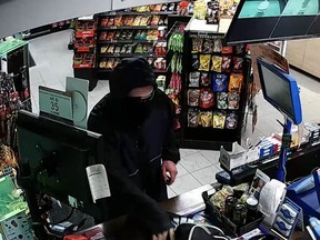 Sarnia police have released a surveillance photo from an alleged robbery at a Pioneer Gas Bar May 13 in Sarnia. Police are searching for the suspect. (Handout/Sarnia Observer/Postmedia Network)