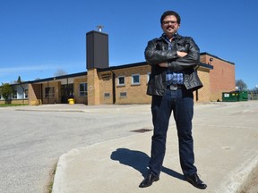 The threatened school behind him, Ashley Chapman of Chapman?s Ice Cream says losing Beavercrest community school in small-town Markdale, near Owen Sound, would be the community?s death knell. The company has pledged $2 million to help keep the school open. (Rob Gowan/Postmedia News)