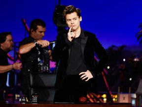 In this image released by CBS, Harry Styles appears on "The Late Late Show with James Corden," Tuesday, May 16, 2017. Styles took over Corden's show for a night by telling a few jokes and poking fun at President Donald Trump and Hillary Clinton. Corden appeared as Styles during a skit and later resumed hosting duties. Styles is spending the week with Corden on the "Late Late Show" in order to promote his new album. (Terence Patrick/CBS via AP)