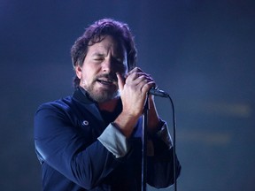 Eddie Vedder, lead singer of Pearl Jam, performs at the Scotiabank Saddledome in Calgary, Alta. on Monday December 2, 2013. (Mike Drew/Postmedia Network)