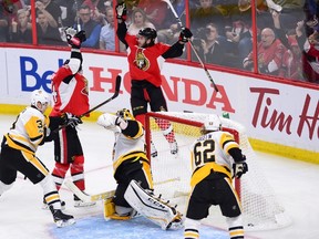 Ottawa Senators left wing Mike Hoffman (68) and left wing Alex Burrows (14) celebrate Hoffman's goal as Pittsburgh Penguins goalie Marc-Andre Fleury (29) during the first period of game three of the Eastern Conference final in the NHL Stanley Cup hockey playoffs in Ottawa on Wednesday, May 17, 2017. THE CANADIAN PRESS/Sean Kilpatrick