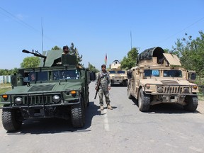 Afghan security personnel keep watch during fighting between Taliban militants and Afghan forces in Kunduz on May 10, 2017. 
Hundreds of Afghan families have fled fighting between the Taliban and government forces near the northern city of Kunduz as the insurgents captured a strategic district soon after launching their annual spring offensive. BASHIR KHAN SAFIBASHIR KHAN SAFI/AFP/Getty Images