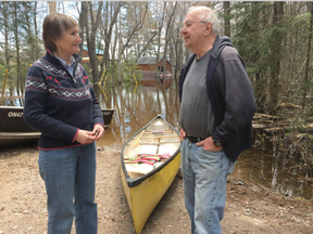 North Algona Wilberforce mayor Deborah Farr discusses flooding with Golden Lake cottager Doug Hildebrandt, who can't reach his cottage because of high water (Joanne Laucius, Postmedia)