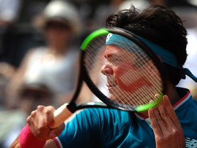 Milos Raonic of Canada returns a ball to Alexander Zverev of Germany at the Italian Open tennis tournament, in Rome on May 19, 2017. (AP Photo/Alessandra Tarantino)