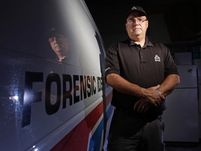 Luke Hendry/intelligencer file photo
Belleville Police Sgt. Grant Boulay stands in his department's garage Friday, May 12, 2014 in Belleville. A veteran forensic identification officer, he's about to be invested into Canada's Order of Merit of the Police Forces.