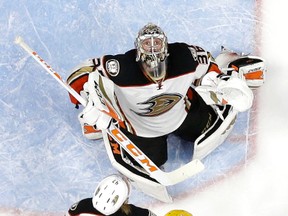 Anaheim Ducks goalie John Gibson watches the puck come down as defenceman Hampus Lindholm battles Nashville Predators centre Mike Fisher during Game 4 of May 18, 2017. (AP Photo/Mark Humphrey)