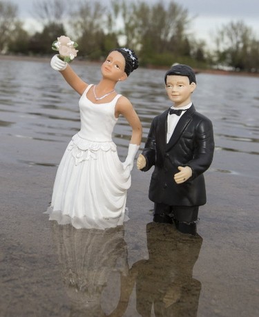 Weddings are being cancelled because of the flood waters in Toronto on Friday May 19, 2017. (Craig Robertson/Toronto Sun)
