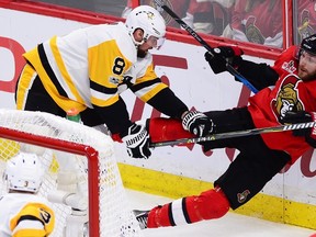 Pittsburgh Penguins defenceman Brian Dumoulin checks Ottawa Senators right winger Bobby Ryan during Game 4 at Canadian Tire Centre on May 19, 2017. (THE CANADIAN PRESS/Sean Kipatrick)