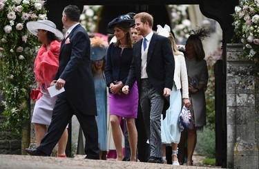 Britain's Prince Harry, right, leaves St. Mark's Church after the wedding ceremony of Pippa Middleton to James Matthews, at St. Mark's Church in Englefield, England Saturday, May 20, 2017. (Justin Tallis/Pool Photo via AP)