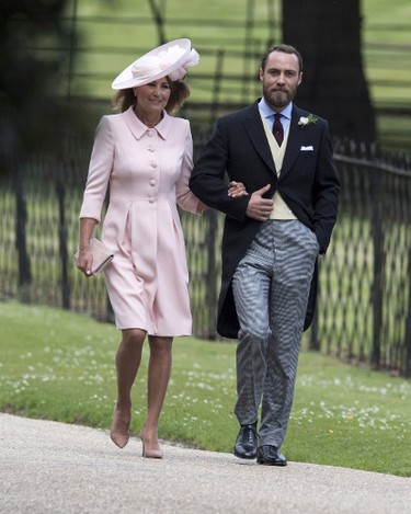 Brother of the bride, James Middleton, escorts his mother Carole Middleton as they arrive for the wedding ceremony of Pippa Middleton to James Matthews at St Mark's Church as the bridesmaids and pageboys walk ahead on May 20, 2017 in Englefield Green, England.  (Arthur Edwards - WPA Pool/Getty Images)