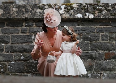 Catherine, Duchess of Cambridge speaks to Princess Charlotte after the wedding of Pippa Middleton and James Matthews at St Mark's Church on May 20, 2017  in Englefield, England. (Kirsty Wigglesworth - Pool/Getty Images)