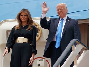 U.S. President Donald Trump and first lady Melania arrive for a welcome ceremony at the Royal Terminal of King Khalid International Airport, Saturday, May 20, 2017, in Riyadh. (AP Photo/Evan Vucci)