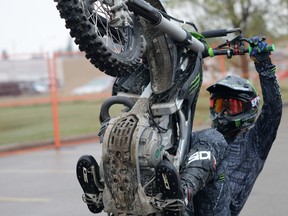 Photo by Marcia Love Reporter/Examiner
Freestyle Motocross (FMX) riders were unable to perform scheduled jump stunts last weekend due to the wet weather. They made up for it with a series of wheelies and other ground stunts.