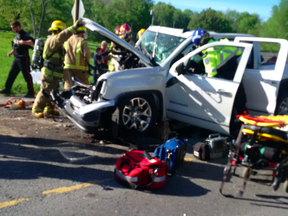 Crews work on to extricate the victims of a crash on Battersea Road. Photo via Frontenac Paramedic Service