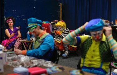 Ringling Bros. clowns take a break between acts in "Clown Alley," a private area backstage, Friday, May 5, 2017, in Providence, R.I.  (AP Photo/Julie Jacobson)