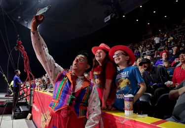 Ringling Bros. clown Ivan Skinfill poses for a selfie photo with children during the intermission of a show, Thursday, May 4, 2017, in Providence, R.I. (AP Photo/Julie Jacobson)