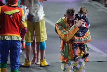 Ringling Bros. boss clown Sandor Eke hugs his 2-year-old son Michael after the red unit's final show, Sunday, May 7, 2017, in Providence, R.I. (AP Photo/Julie Jacobson)