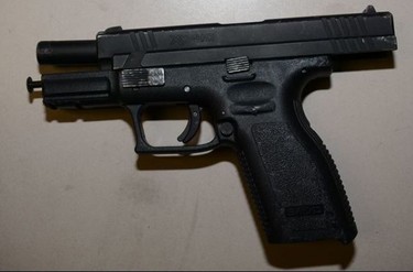 This .40 calibre handgun and double-barrelled sawed-off shotgun were allegedly used by two gunmen who opened fired on a group of people in the courtyard of a west end apartment complex on Thursday, May 18, 2017. (PHOTO SUPPLIED BY TORONTO POLICE)