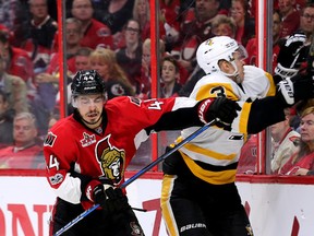 Senators forward Jean-Gabriel Pageau (left) checks Penguins defenceman Olli Maatta during the third period in Game 4 of the NHL's Eastern Conference final in Ottawa on Friday, May 19, 2017. (Wayne Cuddington/Postmedia)