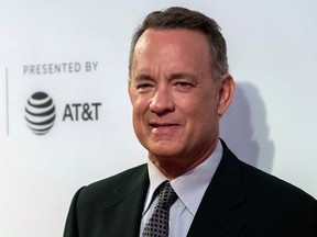 In this April 26, 2017 file photo, Tom Hanks attends "The Circle" premiere during the 2017 Tribeca Film Festival in New York. Hanks is on the beat in New York City, using Twitter Saturday, May 20, 2017, to alert police to a car with a slew of tickets on its windshield. Turns out the tickets were paid. (Photo by Charles Sykes/Invision/AP, File)