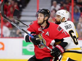 Senators forward Kyle Turris (left) and Penguins defenceman Trevor Daley look for the puck during the third period in Game 4 of the NHL's Eastern Conference final at the Canadian Tire Centre in Ottawa on Friday, May 19, 2017. (Wayne Cuddington/Postmedia)