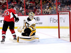 Senators forward Tom Pyatt (left) and Penguins goalie Matthew Murray look back as the puck goes in the net in the third period in Game 4 of the NHL's Eastern Conference final at Canadian Tire Centre in Ottawa on Friday, May 19, 2017. (Wayne Cuddington/Postmedia)