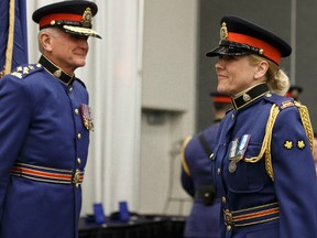 Const. Nathalie Perreault (right) shakes hands with Chief Rod Knecht (left) while receiving a Canadian Peacekeeping Service Medal during an Edmonton Police Service Recognition Ceremony at Edmonton Expo Centre in Edmonton, Alta. on Wednesday, May 17, 2017. Ian Kucerak / Postmedia