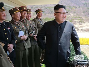 North Korean Leader Kim Jong Un (R) is seen in a file photo. (STR/AFP/Getty Images)
