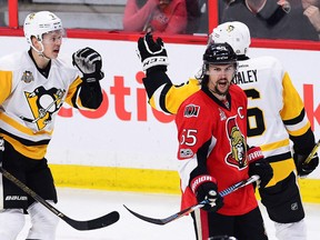 Pittsburgh Penguins defenceman Olli Maatta (3) celebrates his goal with Trevor Daley (6) as Ottawa Senators defenceman Erik Karlsson (65) reacts during Game 4 of the Eastern Conference final in Ottawa on Friday, May 19, 2017. (THE CANADIAN PRESS/Sean Kilpatrick)