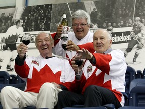 Team Canada ‘72 player Marcel Dionne (middle), raises a toast with teammates Bill White (left) and Ron Ellis in this 2010 file photo. (Craig Robertson/Toronto Sun)