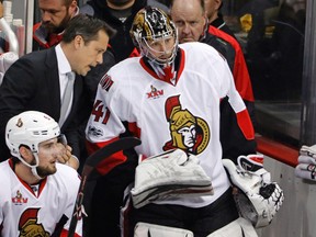 Ottawa Senators coach Guy Boucher, left, talks with goalie Craig Anderson on the bench during Game 5 of the Eastern Conference final in Pittsburgh, Sunday, May 21, 2017. (AP Photo/Gene J. Puskar)