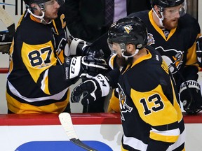 Pittsburgh Penguins’ Nick Bonino (13) celebrates with Sidney Crosby (87) after scoring during Game 5 of the Eastern Conference final in Pittsburgh, Sunday, May 21, 2017. (AP Photo/Gene J. Puskar)