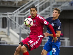 Ottawa Fury FC’s Onua Thomas Obasi (left) tries to keep the ball away from the Riverhounds’ Marshall Hollingsworth. The Fury plays host to TFC tonight. (Ashley Fraser/Postmedia Network)