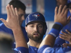 Kevin Pillar of the Toronto Blue Jays is congratulated by teammates in the dugout after scoring a run during an MLB game against the Seattle Mariners at Rogers Centre on May 11, 2017. (Tom Szczerbowski/Getty Images)