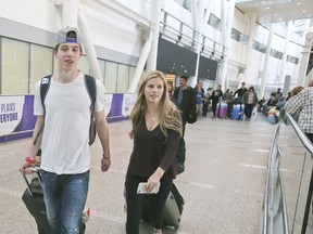 Mitch Marner returns from the IIHF Ice Hockey World Championship, arriving at Pearson Airport in Toronto with his girlfriend on May 22, 2017. (Veronica Henri/Toronto Sun/Postmedia Network)