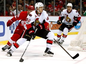 Colin White of the Ottawa Senators tries to escape the defense of Mike Green of the Detroit Red Wings during the second period at Joe Louis Arena on April 3, 2017. (Gregory Shamus/Getty Images)