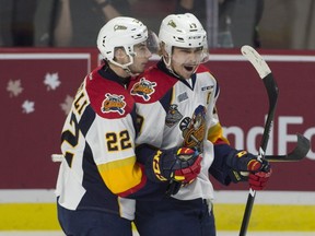 Erie Otters centre Anthony Cirelli congratulates Dylan Strome on his goal during Memorial Cup round robin hockey action against the Saint John Sea Dogs in Windsor on May 22, 2017. (THE CANADIAN PRESS/Adrian Wyld)