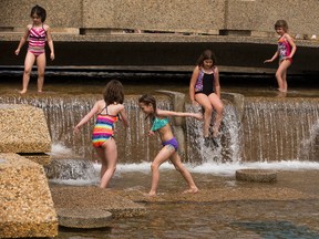 People stay cool in the pool at the Alberta Legislature on Monday May 22, 2017, in Edmonton.  Greg  Southam / Postmedia