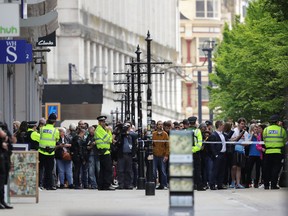 Crowds of people wait outside after police evacuated the Arndale Centre on May 23, 2017 in Manchester, England.  (Photo by Christopher Furlong/Getty Images)