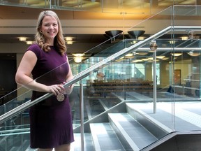 London Public Library senior director Julie Gonyou, the project manager for the Central branch revitalization project, stands on the new stairs that replaced the escalator system in the Dundas Street library. The construction phase of the $4.5-million facelift has been completed. (DALE CARRUTHERS, The London Free Press)